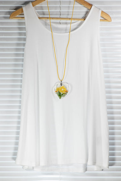 PENDANT YELLOW FLOWER ON YELLOW FLOWERING MEADOW