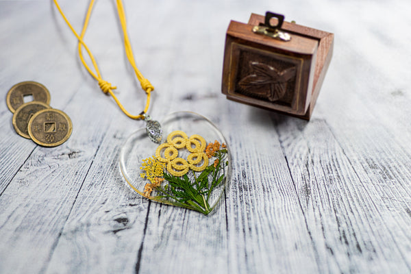 PENDANT YELLOW FLOWER ON YELLOW FLOWERING MEADOW