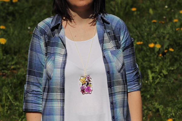 YELLOW BUTTERFLY PENDANT ON PURPLE FLOWERS
