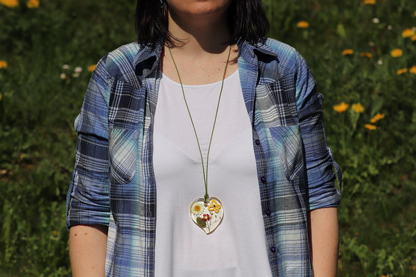 PENDANT OF YELLOW BUTTERFLY ON A SUNNY MEADOW
