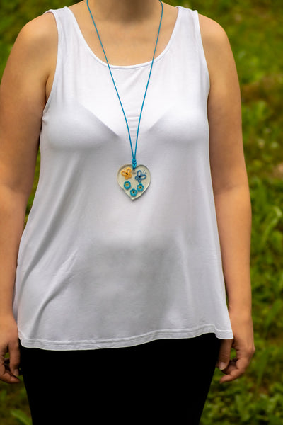 YELLOW AND BLUE BUTTERFLY PENDANT ON FORGET-ME-NOT FLOWERS