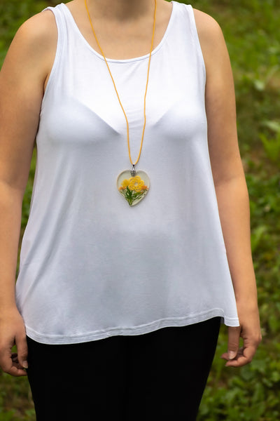 PENDANT YELLOW FLOWER ON YELLOW FLOWERING MEADOW